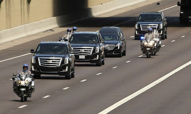 Arizona State Troopers escort the motorcade carrying Sen. John McCain, R-Ariz., as it makes it's wa...