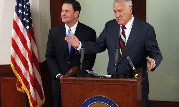 Sen. Jon Kyl, R-Ariz., right, answers a question after Gov. Doug Ducey, R-Ariz., announced the appo...