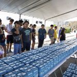 In this photo provided by the Commonwealth of the Northern Mariana Islands, Office Of The Governor, shows volunteers helping deliver water and supplies after Super Typhoon Yutu hit the U.S. Commonwealth of the Northern Mariana Islands in Saipan. Elections are being postponed in the Pacific U.S. territory going without electricity after the super typhoon destroyed homes, toppled trees, utility poles and left a woman dead. The provisions were provided by our FEMA and American Red Cross Partners. (Commonwealth of the Northern Mariana Islands, Office Of The Governor via AP)
