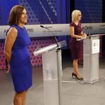 U.S. Senate candidates, U.S. Rep. Martha McSally, R-Ariz., left, and U.S. Rep. Kyrsten Sinema, D-Ariz., prepare their remarks in a television studio prior to a televised debate, Monday, Oct. 15, 2018, in Phoenix. Both ladies are seeking to fill the seat of U.S. Sen. Jeff Flake, R-Ariz., who is not running for re-election. (AP Photo/Matt York)