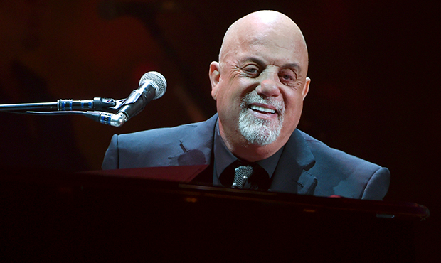 Musician Billy Joel performs during his 100th lifetime performance at Madison Square Garden on Wedn...