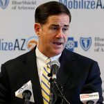 FILE - In this Aug. 14, 2018, file photo, Republican Arizona Gov. Doug Ducey speaks at a news conference in Phoenix, Ariz.  (AP Photo/Ross D. Franklin, File)