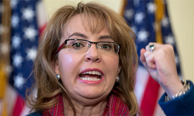 In this March 4, 2015, file photo, former U.S. Rep. Gabrielle Giffords of Arizona gestures as she s...