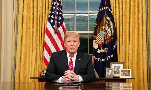 President Donald Trump speaks from the Oval Office of the White House as he gives a prime-time addr...