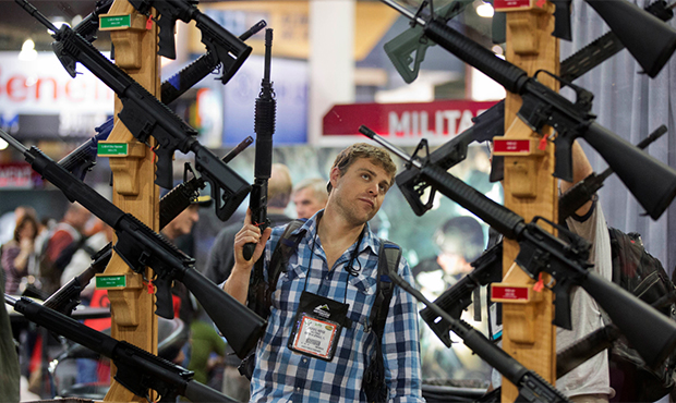 FILE - This Jan. 17, 2013 file photo shows Michael Kiefer of DeFuniak Springs, Fla., checking out a...