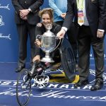 
              Manuela Schar, of Switzerland, receives the trophy after winning the women's handcycle division of the 123rd Boston Marathon on Monday, April 15, 2019, in Boston. (AP Photo/Winslow Townson)
            