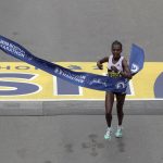
              Worknesh Degefa, of Ethiopia, breaks the tape to win the women's division of the 123rd Boston Marathon on Monday, April 15, 2019, in Boston. (AP Photo/Charles Krupa)
            