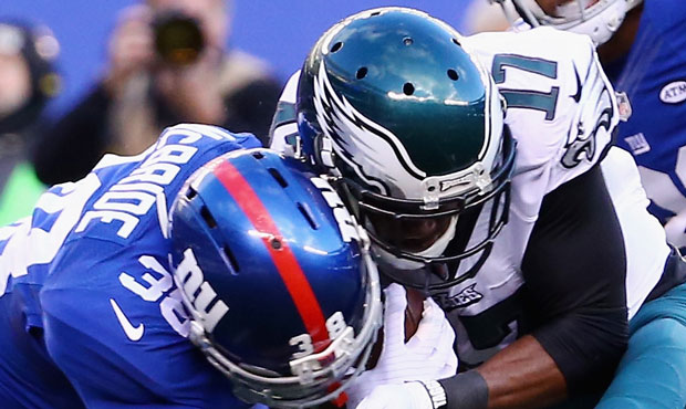 Trumaine McBride #38 of the New York Giants is injured afterthis helmet to helmet hit against Nelso...