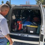 Michael Romero eyes the tools of his electrical trade, packed in the back of his truck while on a job in Tucson. (Photo by Daniel Perle/Cronkite News)