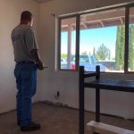 Michael Romero works on a house in Tucson. After time in prison and battling drugs, he recently won back the right to vote. Having that right, he said, "makes you feel worthy." (Photo by Daniel Perle/Cronkite News)