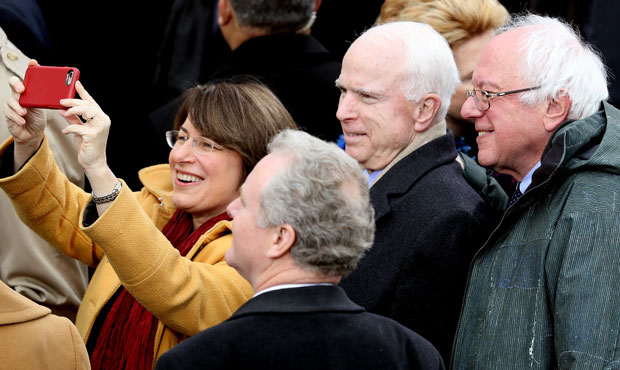 From left, Sen. Amy Klobuchar takes a selfie with Sen. Chris Van Hollen, Sen. John McCain and Sen. ...
