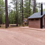 This secluded forest camp offers easy access to two features of high visitor interest.  The first is Knoll Lake, a medium-sized body of water tucked away in a picturesque setting. People come here to fish for trout and tour the lake in small boats.  The second feature of interest near this campground is the spectacular Mogollon Rim, a two thousand foot escarpment that marks the southern edge of the Colorado Plateau. This picturesque plunge from cool highlands to low deserts extends across most of Arizona. The area around Knoll Lake, however, is the home of some of the Rim's most magnificent views. It provides a scenic setting for hiking, mountain biking, horseback riding or just sitting back and enjoying the panorama.  Learn more about Knoll Lake Campground on the Mogollon Rim Ranger District of the Coconino National Forest.  Photo taken July 21, 2017 by Deborah Lee Soltesz. Credit U.S. Forest Service Coconino National Forest.