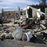 
              A toilet sits in the debris of George Bolter's home destroyed by Hurricane Dorian in the Pine Bay neighborhood of Freeport, Bahamas, Wednesday, Sept. 4, 2019. Rescuers trying to reach drenched and stunned victims in the Bahamas fanned out across a blasted landscape of smashed and flooded homes Wednesday, while disaster relief organizations rushed to bring in food and medicine. (AP Photo/Ramon Espinosa)
            