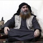 
              FILE - This file image made from video posted on a militant website April 29, 2019, purports to show the leader of the Islamic State group, Abu Bakr al-Baghdadi, being interviewed by his group's Al-Furqan media outlet. The IS erupted from the chaos of Syria and Iraq's conflicts and swiftly did what no Islamic militant group had done before, conquering a giant stretch of territory and declaring itself a "caliphate." U.S. officials said late Saturday, Oct. 26, 2019 that al-Baghdadi was the target of an American raid in Syria and may have died in an explosion. (Al-Furqan media via AP, File)
            