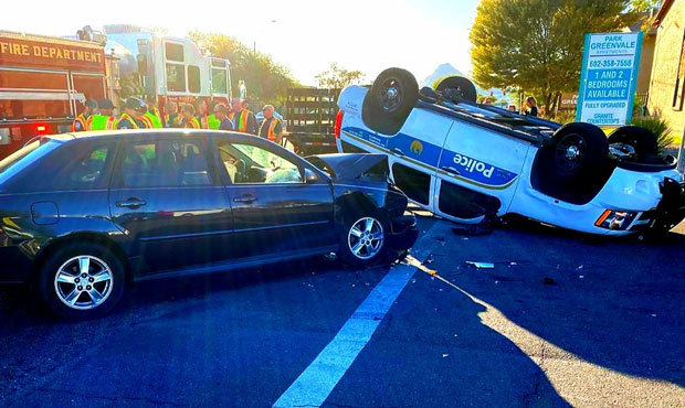 Phoenix police vehicle flips over in hit-and-run collision