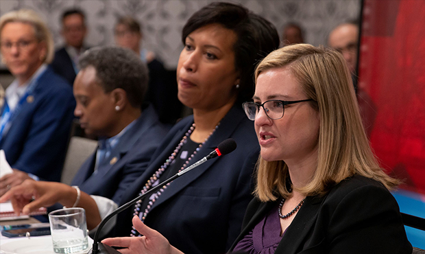 Phoenix Mayor Kate Gallego, right, sits with Washington, D.C., Mayor Muriel Bowser during a morning...