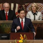 Arizona Republican Gov. Doug Ducey speaks during his State of the State address as he talks about Arizona's economy, new jobs, prison reform, and education as Senate president Karen Fann, R-Prescott, right, and House Speaker Rusty Bowers, R-Mesa, left, listen in on the opening day of the legislative session at the Capitol Monday, Jan. 13, 2020, in Phoenix. (AP Photo/Ross D. Franklin)