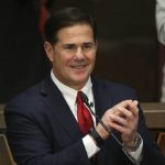 Arizona Republican Gov. Doug Ducey applauds first responders during his State of the State address on the opening day of the legislative session at the Capitol Monday, Jan. 13, 2020, in Phoenix. (AP Photo/Ross D. Franklin)