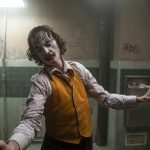 This image released by Warner Bros. Pictures shows Joaquin Phoenix in a scene from "Joker." The film is nominated for a Golden Globe for best motion picture drama. (Niko Tavernise/Warner Bros. Pictures via AP)