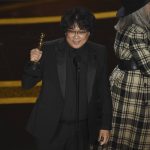 
              Bong Joon Ho accepts the award for best original screenplay for "Parasite" at the Oscars on Sunday, Feb. 9, 2020, at the Dolby Theatre in Los Angeles. (AP Photo/Chris Pizzello)
            