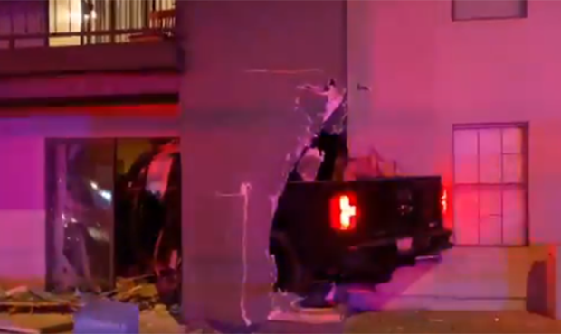 2-car accident causes truck's crash into Mesa apartment building