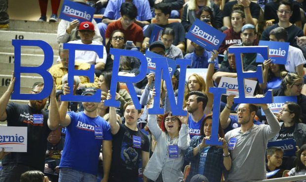 Supporters of Democratic presidential candidate Sen. Bernie Sanders, I-Vt., cheer as they wait for ...