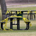 A temporarily closed picnic area is covered with tape to prevent use Saturday, April 11, 2020, in Phoenix. Arizona's two most populous cities are imposing restrictions on use of their parks over the Easter weekend as they try to encourage social distancing to combat spread of the coronavirus. Officials say the Saturday and Sunday of Easter weekend are traditionally very busy days for city parks as families gather to celebrate. Phoenix parks remain open for walking but facilities such as restrooms and parking lots will be closed over the weekend and picnicking and grilling will be prohibited.(AP Photo/Matt York)