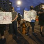 Protesters gather in front of Phoenix City Hall, Saturday, May 30, 2020, in Phoenix while protesting the death of George Floyd, a handcuffed black man who died in Minneapolis police custody on May 25. (AP Photo/Ross D. Franklin)