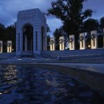 This May 6, 2020, photo shows the World War II Memorial in Washington. May 8, 2020 will mark the 75th anniverary of Nazi Germany's surrender, ending World War II in Europe. Eight World War II veterans will join President Donald Trump at a wreath-laying ceremony Friday to commemorate the 75th anniversary of the end of the war in Europe. In the midst of the coronavirus pandemic, White House officials describe the veterans as "choosing nation over self" by joining Trump at the World War II Memorial ceremony.  (AP Photo/Patrick Semansky)