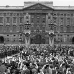 
              FILE - In this May 8, 1945 file photo a vast crowd assembles in front of Buckingham Palace, London to cheer Britain's Royal family as they come out on the balcony, centre, minutes after the official announcement of Germany's unconditional surrender in World War II. They are from left: Princess Elizabeth; Queen Elizabeth; King George VI; and Princess Margaret. Nazi commanders signed their surrender to Allied forces in a French schoolhouse 75 years ago this week, ending World War II in Europe and the Holocaust. Unlike the mass street celebrations that greeted this momentous news in 1945, surviving veterans are marking V-E Day this year in virus confinement, sharing memories with loved ones, instead of in the company of comrades on public parade. (AP Photo/Leslie Priest, File)
            
