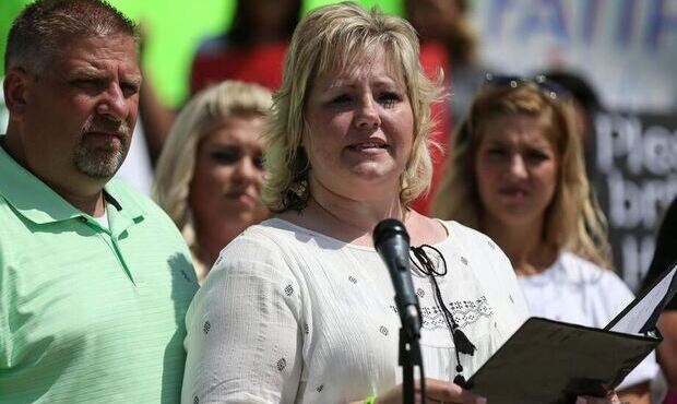 Jason and Laurie Holt call for their son Josh's release from a Venezuelan jail at a rally at the Ut...