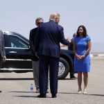 From left, Rep. Andy Biggs, R-Ariz., Rep. Paul Gosar, R-Ariz., Sen. Martha McSally, R-Ariz., and Arizona Gov. Doug Ducey greet President Donald Trump at Yuma International Airport, Tuesday, Aug. 18, 2020, in Yuma, Ariz. (AP Photo/Evan Vucci)