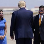 Sen. Martha McSally, R-Ariz., left and Arizona Gov. Doug Ducey, right, greet President Donald Trump at Yuma International Airport, Tuesday, Aug. 18, 2020, in Yuma, Ariz. (AP Photo/Evan Vucci)