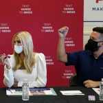 Daughter and adviser of President Donald Trump, Ivanka Trump, left, works a phone bank at Latinos For Trump headquarters with other volunteers Wednesday, Sept. 16, 2020, in Phoenix. (AP Photo/Ross D. Franklin)