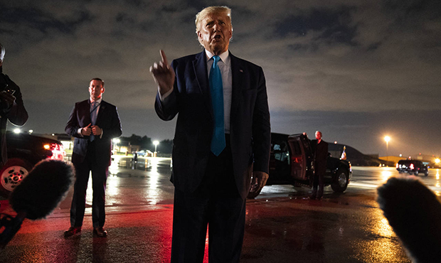 President Donald Trump talks with reporters at Andrews Air Force Base after attending a campaign ra...