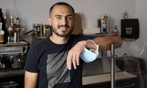 New U.S. citizen Jad "Jay" Jawad, owner of the Crepe House Cafe, who came to the U.S. as a refugee ...