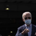 Democratic presidential candidate former Vice President Joe Biden arrives on his campaign plane at Phoenix Sky Harbor International Airport, in Phoenix, Thursday, Oct. 8, 2020. (AP Photo/Carolyn Kaster)