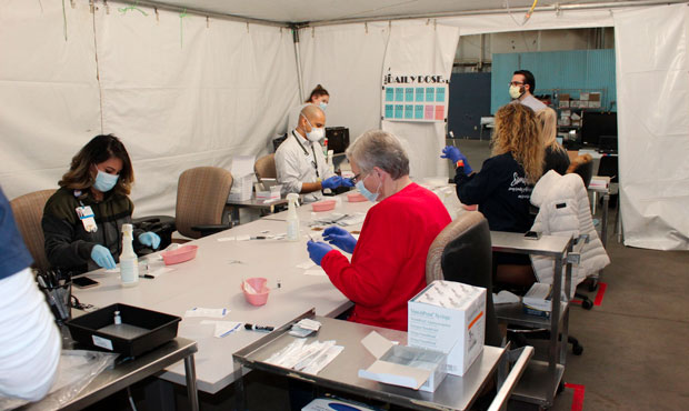COVID-19 vaccines are prepared for health care workers in Phoenix on Dec. 17, 2020. (Facebook Photo...