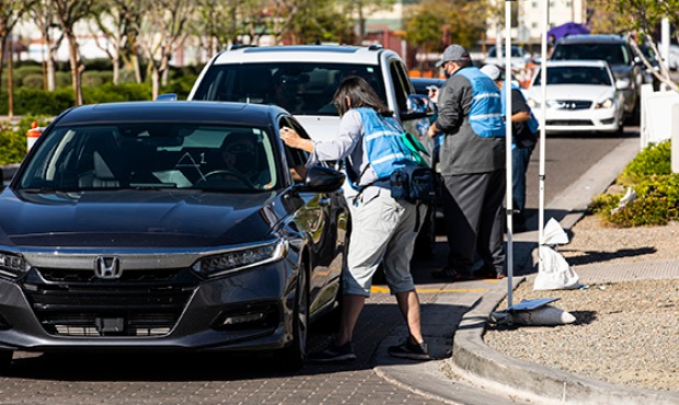 A steady stream of cars has flowed through the Point of Dispensing site at 27th Avenue and Camelbac...