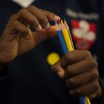 A pupil in the reception class counts out his color pencils as he begins a maths lesson at the Holy Family Catholic Primary School in Greenwich, London, Monday, May 24, 2021. (AP Photo/Alastair Grant)