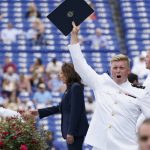 
              A U.S. Naval Academy graduate celebrates after getting his diploma as Vice President Kamala Harris greets the graduating Class of 2021 during the graduation and commissioning ceremony at the U.S. Naval Academy in Annapolis, Md., Friday, May 28, 2021. Harris is the first woman to give the graduation speech at the Naval Academy. (AP Photo/Susan Walsh)
            