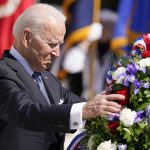 
              President Joe Biden adjusts a wreath at the Tomb of the Unknown Soldier at Arlington National Cemetery on Memorial Day, Monday, May 31, 2021, in Arlington, Va.(AP Photo/Alex Brandon)
            
