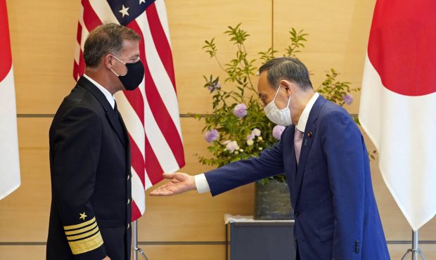 Admiral John C. Aquilino, left, Commander of the United States Indo-Pacific Command, is welcomed by...