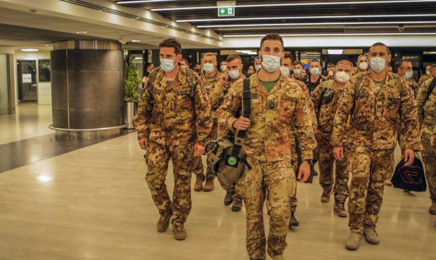 Italian Army soldiers of the last Italian troops withdrawing from Afghanistan walk in the airport i...