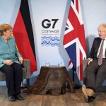 
              Britain's Prime Minister Boris Johnson, right, and German Chancellor Angela Merkel ahead of a bilateral meeting during the G7 summit in Cornwall, England, Saturday June 12, 2021. (Stefan Rousseau/Pool via AP)
            