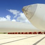 FILE - This July 29, 2016 file photo shows wind turbine blades at the Port of Brownsville, Texas. On Friday, June 25, 2021, the Associated Press reported on stories circulating online incorrectly claiming a photo shows a wind turbine that melted in the Texas heat.  (Jason Hoekema/The Brownsville Herald via AP)