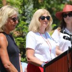 
              Andrea Chamblee, the widow of John McNamara who was one of the five people killed three years ago in the Capital Gazette mass shooting, speaks at the dedication of a memorial to the victims on Monday, June 28, 2021 in Annapolis, Md. Maria Hiaasen, the widow of slain newspaper editor Rob Hiaasen, is standing left. Summerleigh Winters, the daughter of Wendi Winters who also was killed in the attack, is standing right. (AP Photo/Brian Witte)
            