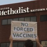 
              People bring signs to protest Houston Methodist Hospital system's rule of firing any employee who is not immunized by Monday, June 7, 2021, at Houston Methodist Baytown Hospital in Baytown, Texas. Houston Methodist staff who have refused the COVID-19 vaccine so far and their supporters participated in a gathering and march. (Yi-Chin Lee/Houston Chronicle via AP)
            