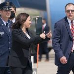 
              Vice President Kamala Harris, center, makes a double thumbs up sign toward members of the media after exiting Air Force Two after a technical issue required the plane to return to Andrews Air Force Base, Md., Sunday, June 6, 2021, after it had already started begun flying to Guatemala City. (AP Photo/Jacquelyn Martin)
            