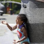 
              Mellena O'Brien, 4, plays in the Yesler TerraceSpray Park during a heat wave hitting the Pacific Northwest, Sunday, June 27, 2021, in Seattle. Yesterday set a record high for the day with more record highs expected today and Monday. (AP Photo/John Froschauer)
            
